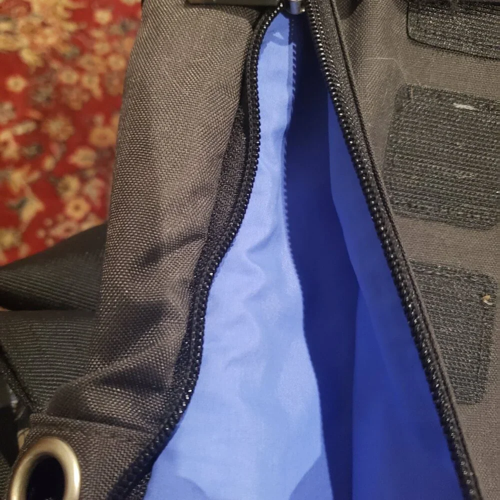 Moleskine Messenger Backpack Computer Bag. Black with Blue and Green Interior